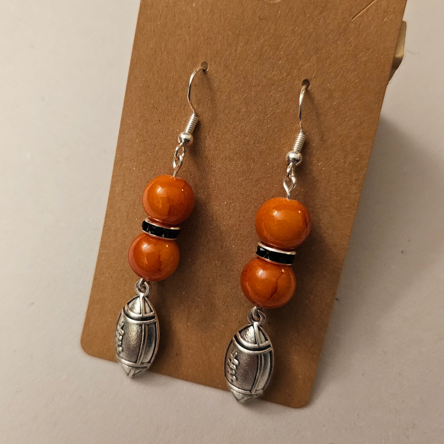 Orange and Black Silvery Football Earrings