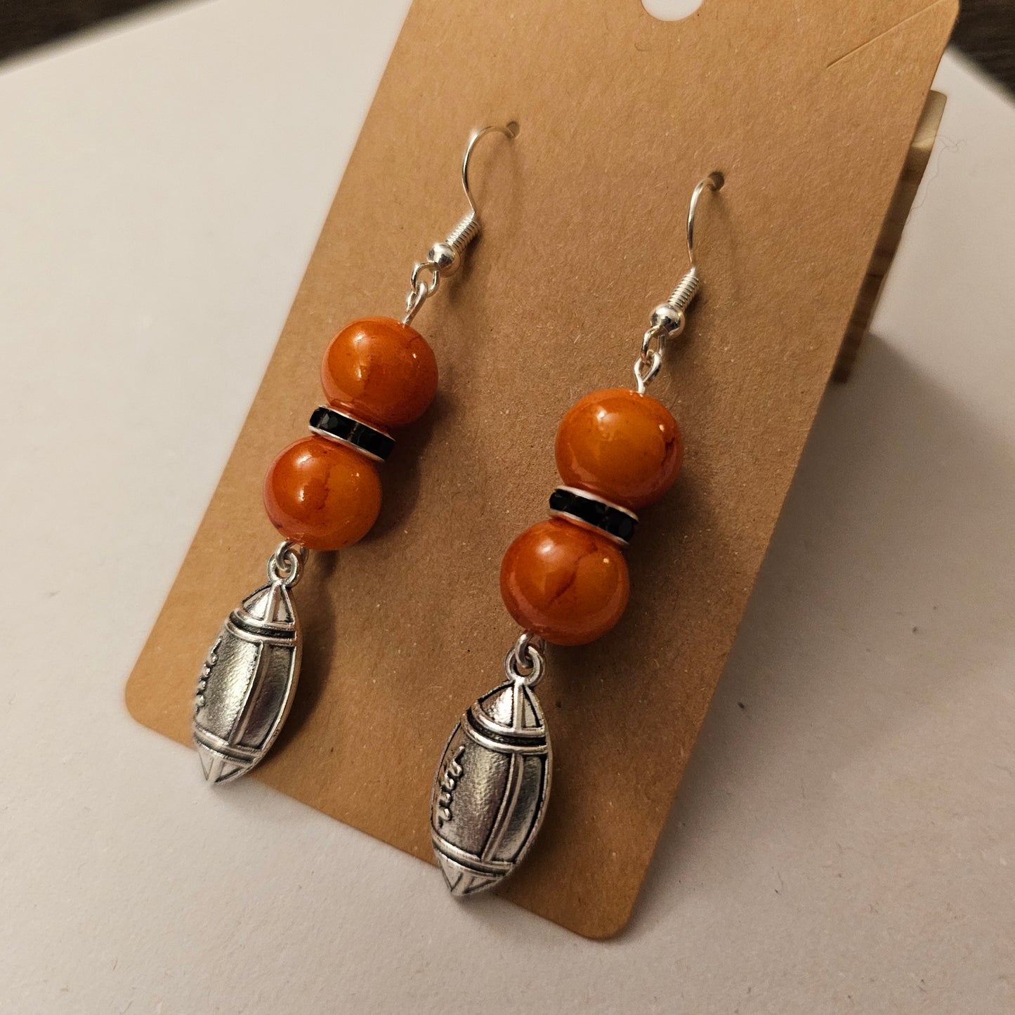 Orange and Black Silvery Football Earrings